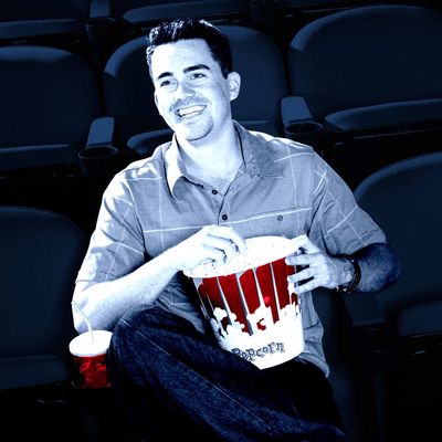 Man Watching Movie in Empty Theater --- Image by ? moodboard/Corbis