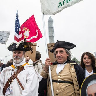 WASHINGTON, DC - OCTOBER 13: A crowd gathers at the World War Two Memorial to support a rally centered around reopening national memorials closed by the government shutdown, supported by military veterans, Tea Party activists and Republicans, on October 13, 2013 in Washington, DC. The rally was inspired by a desire to re-open national memorials, including the World War Two Memorial in Washington DC, though the rally also focused on the government shutdown and frustrations against President Obama. (Photo by Andrew Burton/Getty Images)