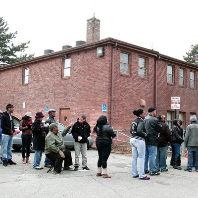 DETROIT, MI - NOVEMBER 6: U.S. citizens wait in a long line to vote in the presidential election at Community House November 6, 2012 in Detroit, Michigan. The race between Democratic President Barack Obama and Republican nominee former Massachusetts Gov. Mitt Romney remains tight as Americans head to the polls to cast their ballots. (Photo by Bill Pugliano/Getty Images)