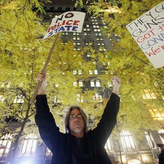 NEW YORK, NY - NOVEMBER 15: A protester celebrates after re-entering Zuccotti Park after police removed the Occupy Wall Street protesters from the park early in the morning on November 15, 2011 in New York City. Police had removed the protesters from the park early in the morning. A judge ruled that protesters are allowed back to the park but won't be allowed to camp there. Hundreds of protesters, who rallied against inequality in America, have slept in tents and under tarps since September 17 in Zuccotti Park, which has since become the epicenter of the global Occupy movement. The raid in New York City follows recent similar moves in Oakland, California, and Portland, Oregon. (Photo by Mario Tama/Getty Images)