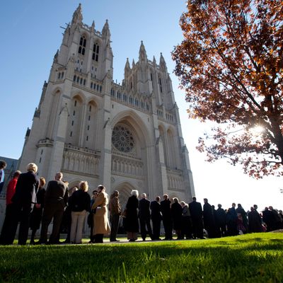 People wait outside the Washington National Cathedral before the consecration service of Washington's first woman and 9th Episcopal Bishop, the Rev. Mariann Edgar Budde, Saturday, Nov. 12, 2011. 