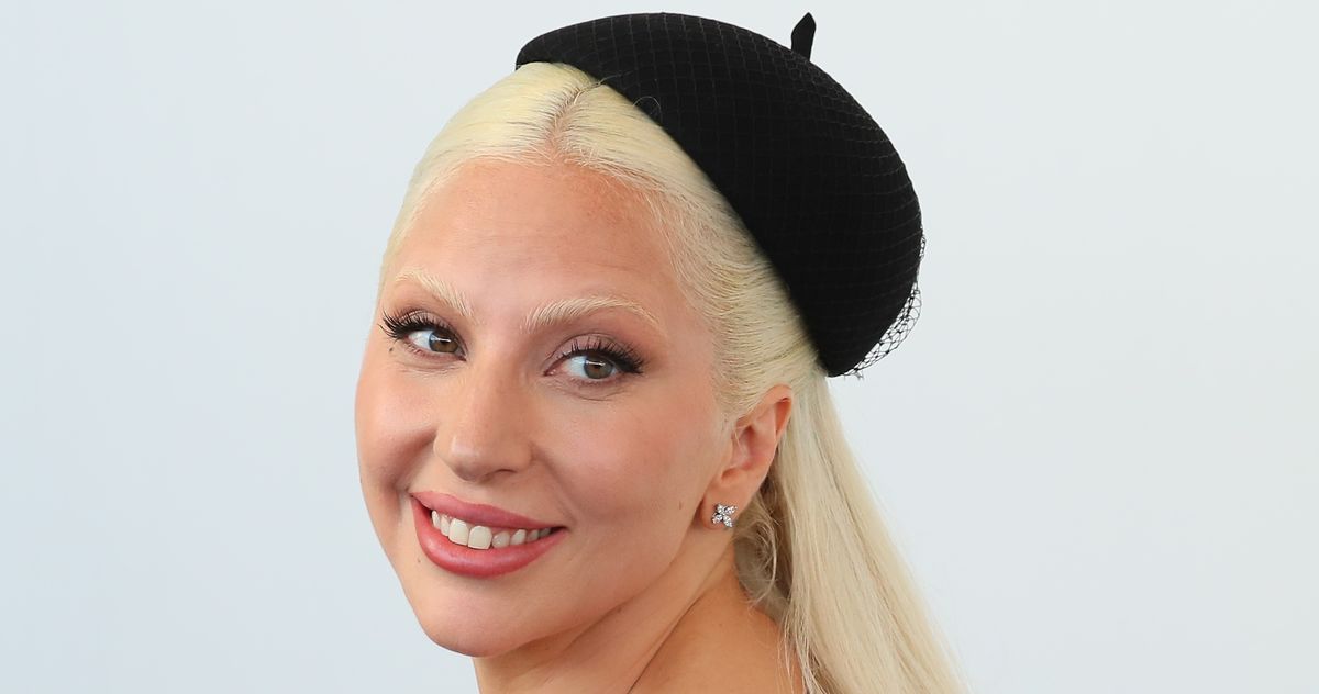 Lady Gaga with long black hair and bleached eyebrows in Paris