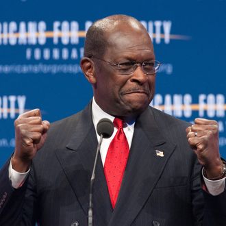 US Republican presidential hopeful Herman Cain arrives to address the 