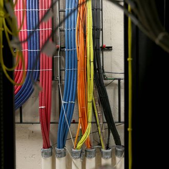 Cables at a Comcast distribution center are seen where the Comcast regional video, high speed data and voice are piped out to customers on February 13, 2014 in Pompano Beach, Florida. Today, Comcast announced a $45-billion offer for Time Warner Cable. 