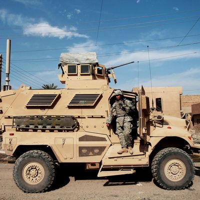 A soldier with the U.S. Army's 2-12 infantry stands on a MRAP vehicle while on patrol November 17, 2007 in Baghdad, Iraq. MRAPs are a family of mine-resistant transport vehicles; a set recently arrived at FOB Falcon are simply called MRAPs by the soldiers but are technically called International MaxxPro Category 1. Some commanders in the U.S. military see MRAPs as eventual replacements for the ageing Humvee, though the vehicles large size and other factors have given other commanders paU.S. e. MRAPs have a V-shaped hull that allows it to better withstand the blasts of roadside bombs. 