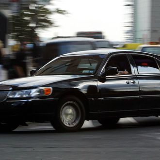 A black limousine-service car makes its way near Wall Street August 9, 2004 in New York City. Government officials have warned that intelligence points toward terrorists considering using tourist helicopters and Manhattan's ubiquitous limousine cars as possible attack vehicles on the city.
