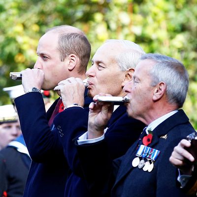 Prince William drinking out of a flask.