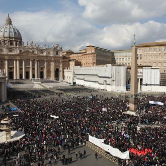 VATICAN CITY, VATICAN - FEBRUARY 24: Crowds gather to see Pope Benedict XVI deliver his last Angelus Blessing from the window of his private apartment to thousands of pilgrims gathered in Saint Peter's Square on February 24, 2013 in Vatican City, Vatican. The Pontiff will hold his last weekly public audience on February 27, 2013 before he retires the following day. Pope Benedict XVI has been the leader of the Catholic Church for eight years and is the first Pope to retire since 1415. He cites ailing health as his reason for retirement and will spend the rest of his life in solitude away from public engagements. (Photo by Oli Scarff/Getty Images)