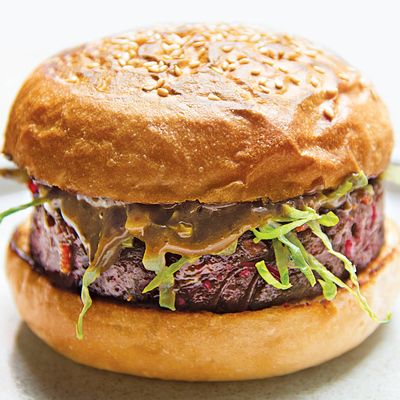 The patty for the veggie burger is made with beets, lentils, and vermicelli noodles, and topped with black-garlic aioli and shredded lettuce.