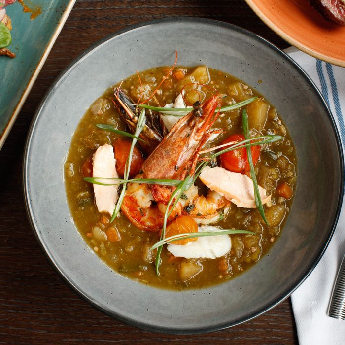 Moqueca: Brazilian fish stew with salt cod, okra, prawns, and Thai basil.