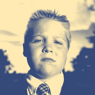 Boy (8-10) wearing school uniform, portrait