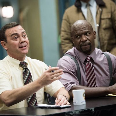 BROOKLYN NINE-NINE: Det. Boyle (Joe Lo Truglio, L) and Sgt. Jeffords (Terry Crews, R) listen in for their next assignment in the 