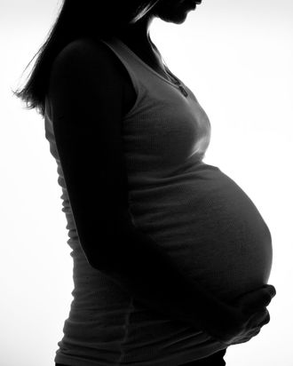 Woman holding a baby.