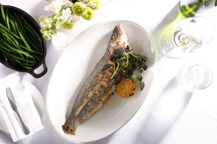 Herb-roasted whole branzino​ ​with​ ​lemon-oregano vinaigrette​ and ​haricot vert.