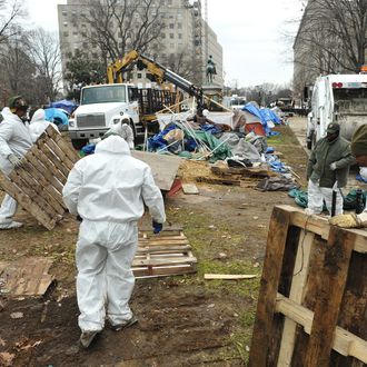 US National Park Service workers remove debris from the site of the Occupy DC encampment February 5, 2012 in McPherson Square in Washington, DC. AFP PHOTO / MANDEL NGAN (Photo credit should read MANDEL NGAN/AFP/Getty Images)