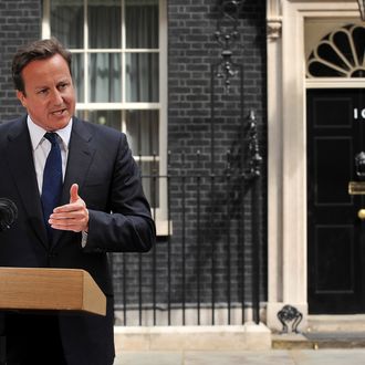 Britain's Prime Minister David Cameron addresses the media outside 10 Downing Street in London, on August 10, 2011, following a fourth night of violence in Britain. Youths smashed their way into stores and torched cars in central England on Tuesday, police said, as Britain's worst riots for decades entered a fourth night. AFP PHOTO / BEN STANSALL (Photo credit should read BEN STANSALL/AFP/Getty Images)