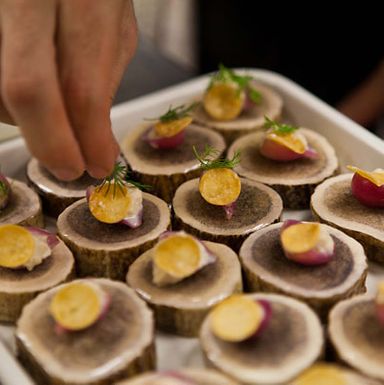 Adjusting the pickled-herring bites.
