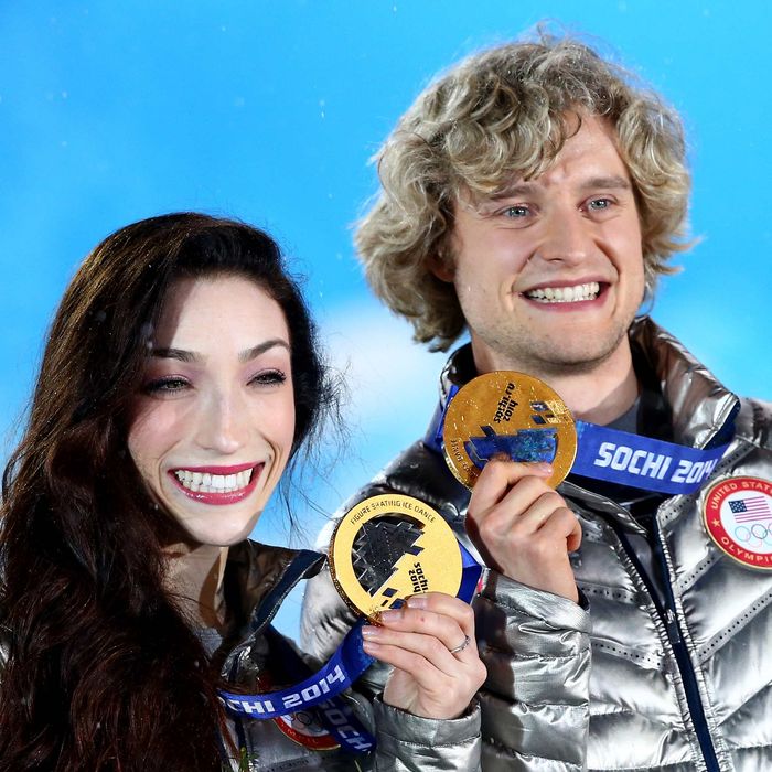 Gold medalists Meryl Davis (L) and Charlie White of the United States celebrate during the medal ceremony for the Figure Skating Ice Danceon day 11 of the Sochi 2014 Winter Olympics at Medals Plaza on February 18, 2014 in Sochi, Russia. (Photo by Ryan Pierse/Getty Images)