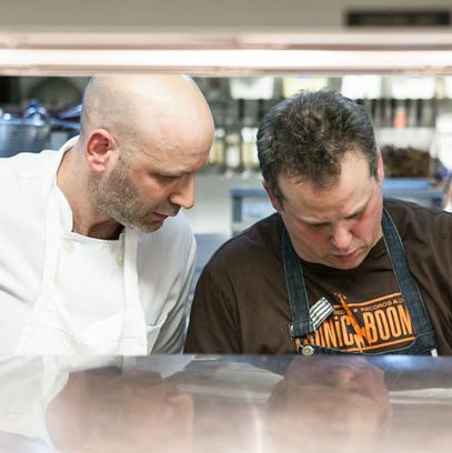 Chef Marc Vetri looks on as Paul Kahan plates.