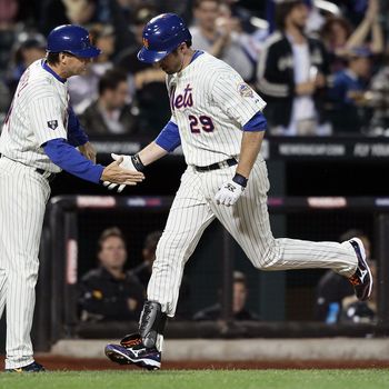 Ike Davis #29 of the New York Mets celebrates a home run with coach Tim Teufel in the fourth inning against the Pittsburgh Pirates at Citi Field on September 24, 2012 in the Flushing neighborhood of the Queens borough of New York City.