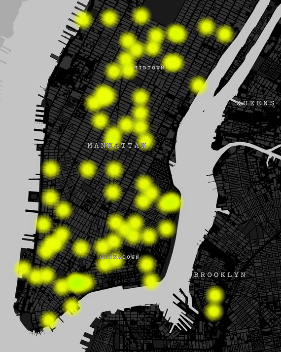 A black and gray map of Manhattan with yellow spots showing where attacks on Asian Americans have occurred