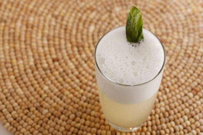 The herbed gin fizz, made with London dry gin, lime, sugar, pear liqueur, sage, and egg whites.