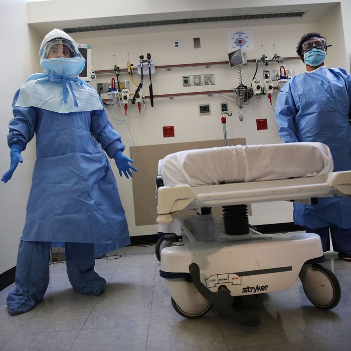 NEW YORK, NY - OCTOBER 08: Members of Bellevue Hospital staff wear protective clothing as they demonstrate how they would receive a suspected Ebola patient on October 8, 2014 in New York City. If the patient was confirmed to be carrying the deadly virus the person would be sent to an isolation unit for treatment. The first person diagnosed with Ebola in the United States, Liberian Thomas Duncan, has died at a Dallas hospital, Texas Health Presbyterian Hospital said. (Photo by Spencer Platt/Getty Images)