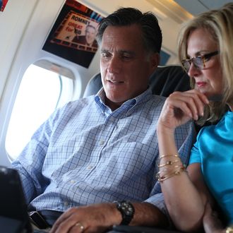 IN FLIGHT, UNITED STATES - SEPTEMBER 01: Republican presidential candidate, former Massachusetts Gov. Mitt Romney (L) and his wife Ann Romney talk on the campaign plane on September 1, 2012 en route to New Hampshire. Mitt Romney is going to his vacation home in New Hampshire for a few days off following the Republican National Convention and a few days of campaigning. (Photo by Justin Sullivan/Getty Images)