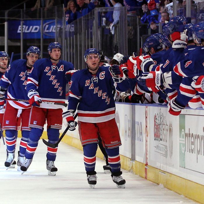  Ryan Callahan #24 of the New York Rangers celebrates with teammates on the bench after he scored a first period goal against the Ottawa Senators in Game One of the Eastern Conference Quarterfinals during the 2012 NHL Stanley Cup Playoffs at Madison Square Garden on April 12, 2012 in New York City. 