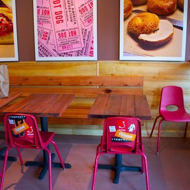 Unlike the Deli Board's previous, takeout-only location operating out of a single doorway, the new space has real tables and chairs!
