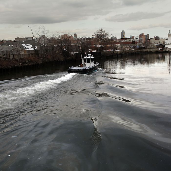 A boat navigates down the polluted Gowanus Canal on March 2, 2010 in the Brooklyn borough of New York. 