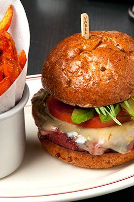 Vegetables, spices, avocado, jack cheese, wheatgrass, whole-wheat bun.