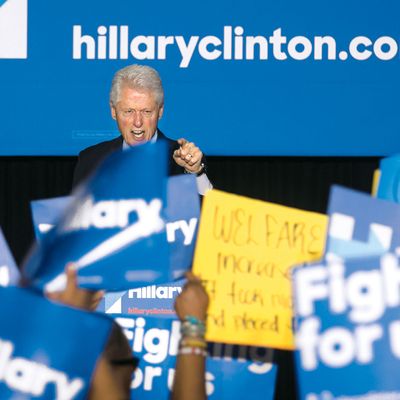 Former President Bill Clinton has a heated exchange with a protester during a rally for Democratic presidential candidate Hillary Clinton, Thursday April 7, 2016, in Philadelphia. Bill Clinton was interrupted by people in the crowd holding signs reading 
