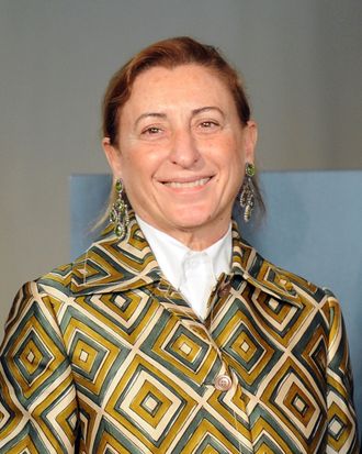Italian designer Miuccia Prada poses during a press conference announcing the 'Schiaparelli and Prada: Impossible Conversations' exhibition on February 24, 2012 during the Women's fashion week in Milan. The exhibition, curated by Harold Koda and Andrew Bolton and sponsored by the Conde Nast publishing group, running at the New York Metropolitan museum of art from May 10 to August 19, 2012 will feature iconic costumes and approximately 90 designs and 30 accessories by Italian designers Elsa Schiaparelli (1890–1973) from the late 1920s to the early 1950s, and by Miuccia Prada from the late 1980s to the present. 
