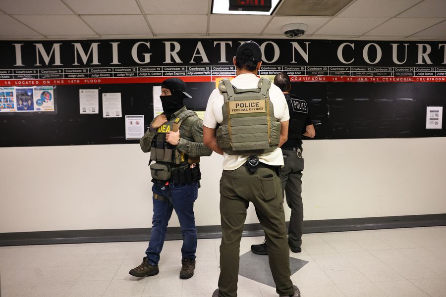 Federal agents patrol the halls of immigration court at the Jacob K. Javits Federal Building on June 9.