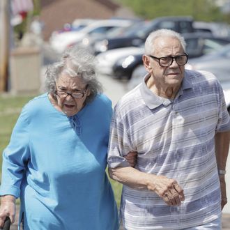 Senior Couple Walking Together on Sunny Day