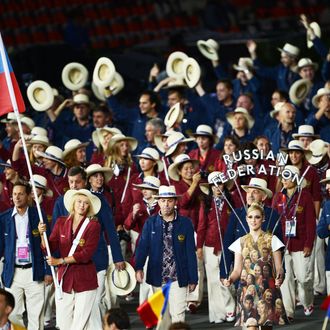Russia's flagbearer Maria Sharapova lead