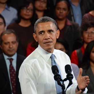 San Francisco, United States. 25th November 2013 -- President Obama talks about immigration reform at the Betty Ann Ong Chinese Recreation Center in San Francisco. -- President Obama spoke about an interim nuclear deal with Iran before giving an address on immigration reform at the Betty Ann Ong Chinese Recreation Center in San Francisco. Towards the end, he was interrupted by shouts of 