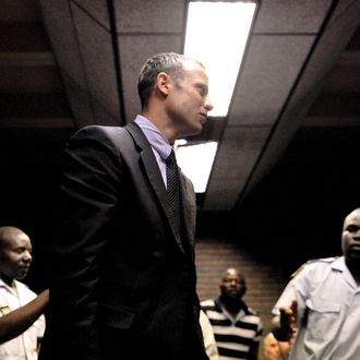 South Africa's Olympic sprinter Oscar Pistorius leaves the court room after his hearing on charge of murdering his model girlfriend Reeva Steenkamp on Valentine's Day, yesterday, on February 15, 2013 at the Magistrate Court in Pretoria. South African prosecutors will argue that Pistorius is guilty of premeditated murder in Steenkamp's death, a charge which could carry a life sentence.