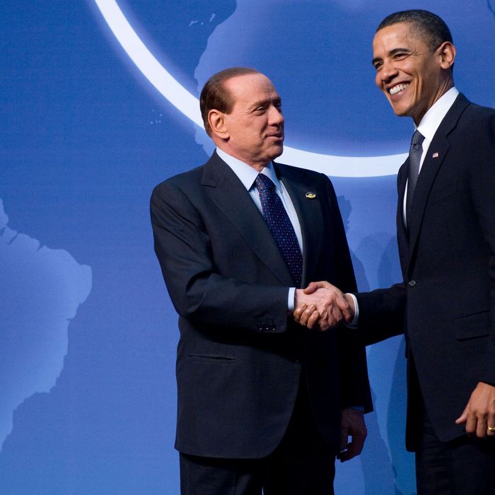 US President Barack Obama (R) greets Italian Prime Minister Silvio Berlusconi upon his arrival for dinner during the Nuclear Security Summit at the Washington Convention Center in Washington, DC, April 12, 2010. AFP PHOTO / Jim WATSON (Photo credit should read JIM WATSON/AFP/Getty Images)