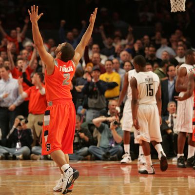 Justin Thomas #2 of the Syracuse Orange celebrates late in the sixth overtime against the Connecticut Huskies during the quarterfinal round of the Big East Tournament at Madison Square Garden on March 12, 2009 in New York City. 