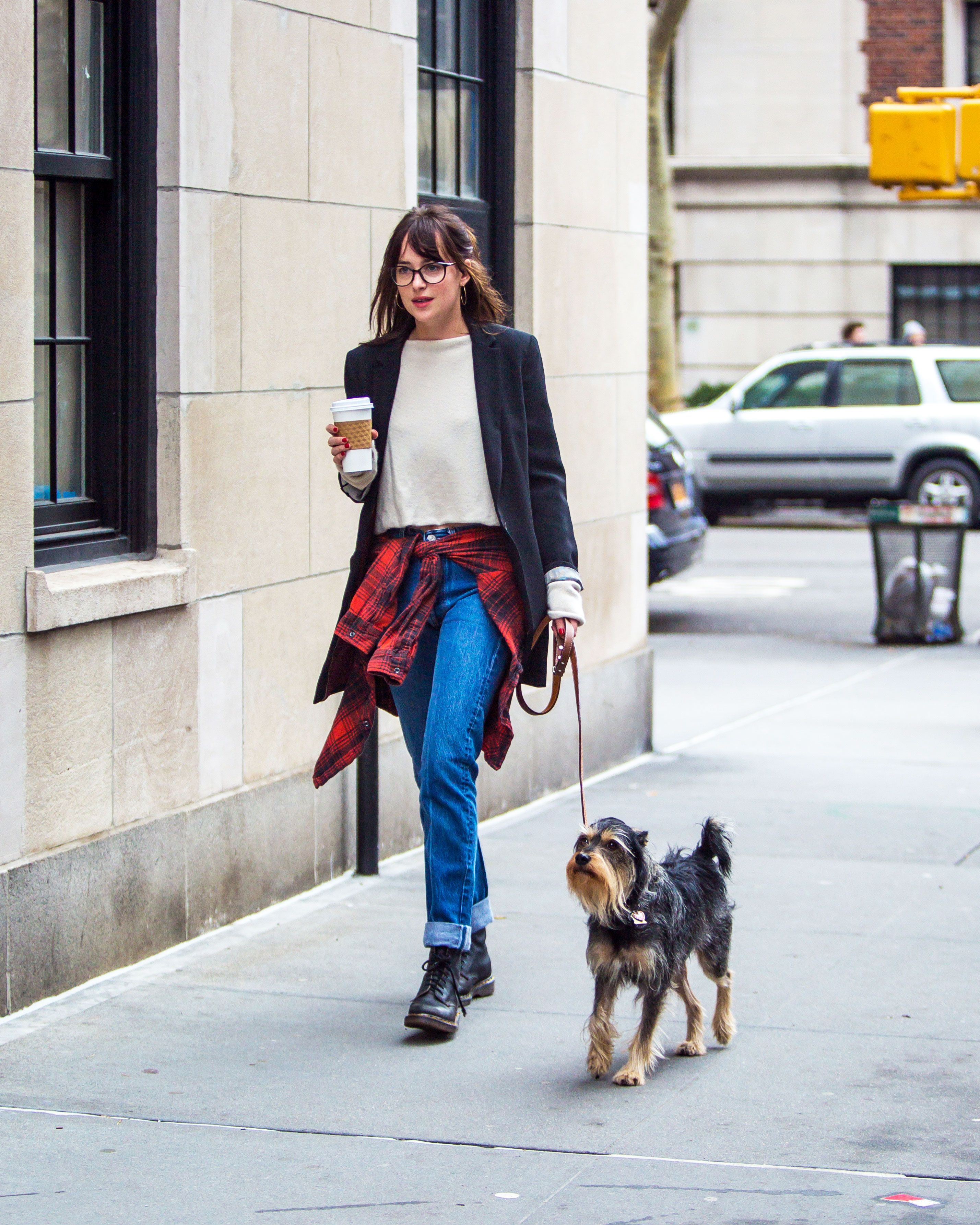 Dakota Johnson heads out to meetings with a cup of coffee and