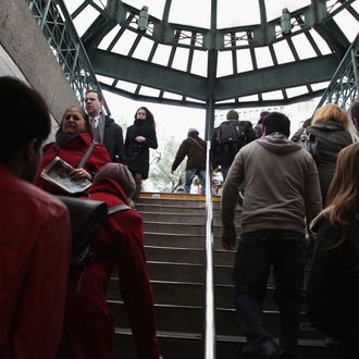 NEW YORK, NY - NOVEMBER 05: Commuters enter and exit the Union Square subway station November 5, 2012 in New York City. A week after Superstorm Sandy hit the city, most of the subway lines are running, with some lines still suspended and others running on a limited basis. (Photo by Preston Rescigno/Getty Images)