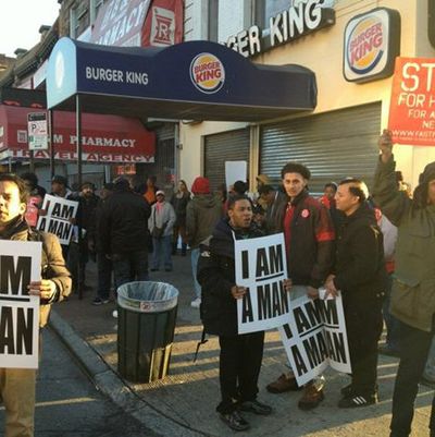Workers strike outside a Burger King in Brooklyn early this morning.