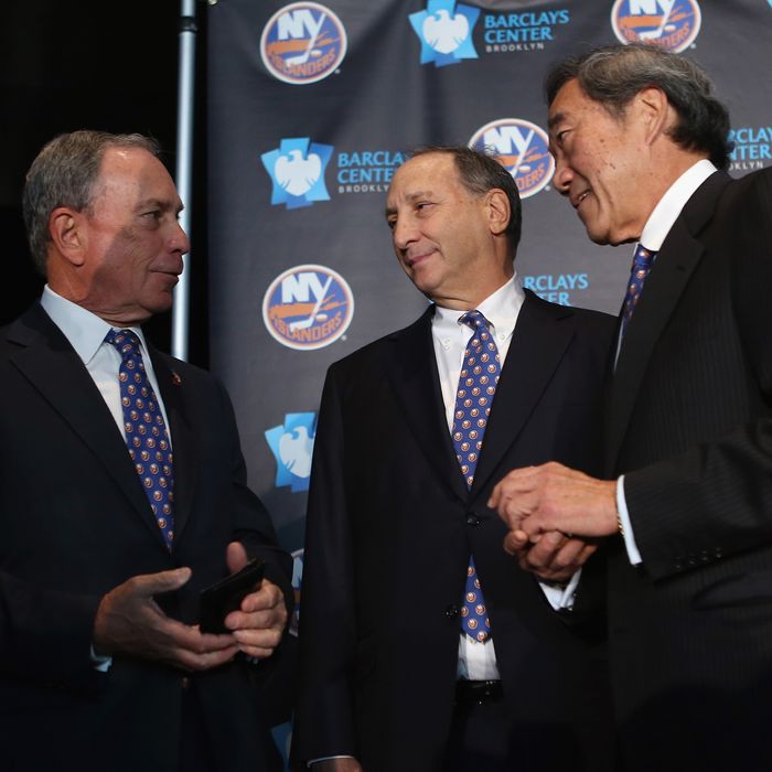 (L-R) Mayor Michael Bloomberg, owner Bruce Ratner of the Brooklyn Nets and New York Islanders owner Charles Wang announce the team's move to Brooklyn in 2015 at a press conference at the Barclays Center on October 24, 2012 in the Brooklyn borough of New York City. 