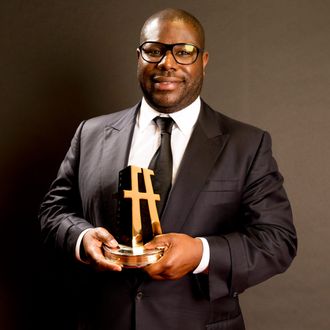 Director Steve McQueen poses with the Hollywood Breakout Director Award for '12 Years a Slave' in the portrait studio during the 17th annual Hollywood Film Awards at The Beverly Hilton Hotel on October 21, 2013 in Beverly Hills, California. 