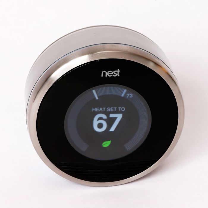 PROVO, UT - JANUARY 16: In this photo illustration, a Nest thermostat is seen on January 16, 2014 in Provo, Utah. Google bought Nest, a home automation company, for $3.2 billion taking Google further into the home ecosystem. (Photo Illustration by George Frey/Getty Images)