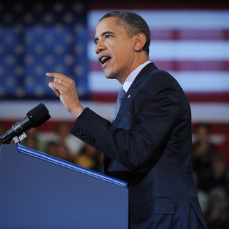 US President Barack Obama speaks on the economy and an extension of the payroll tax cut at Osawatomie High School December 6, 2011 in Osawatomie, Kansas. 