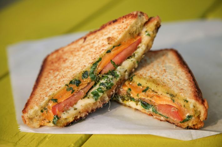 Cheddar and muenster grilled cheese, baby kale, housemade chimichurri sauce, and tomato.