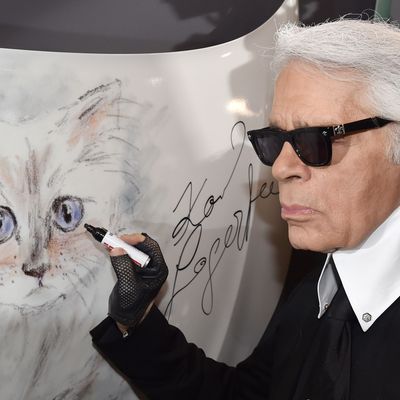 Karl Lagerfeld and a portrait of Choupette.